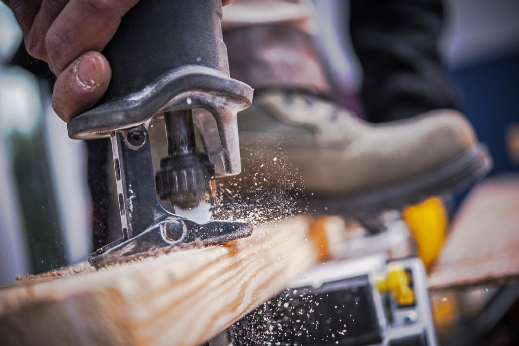 A contractor uses a reciprocating saw